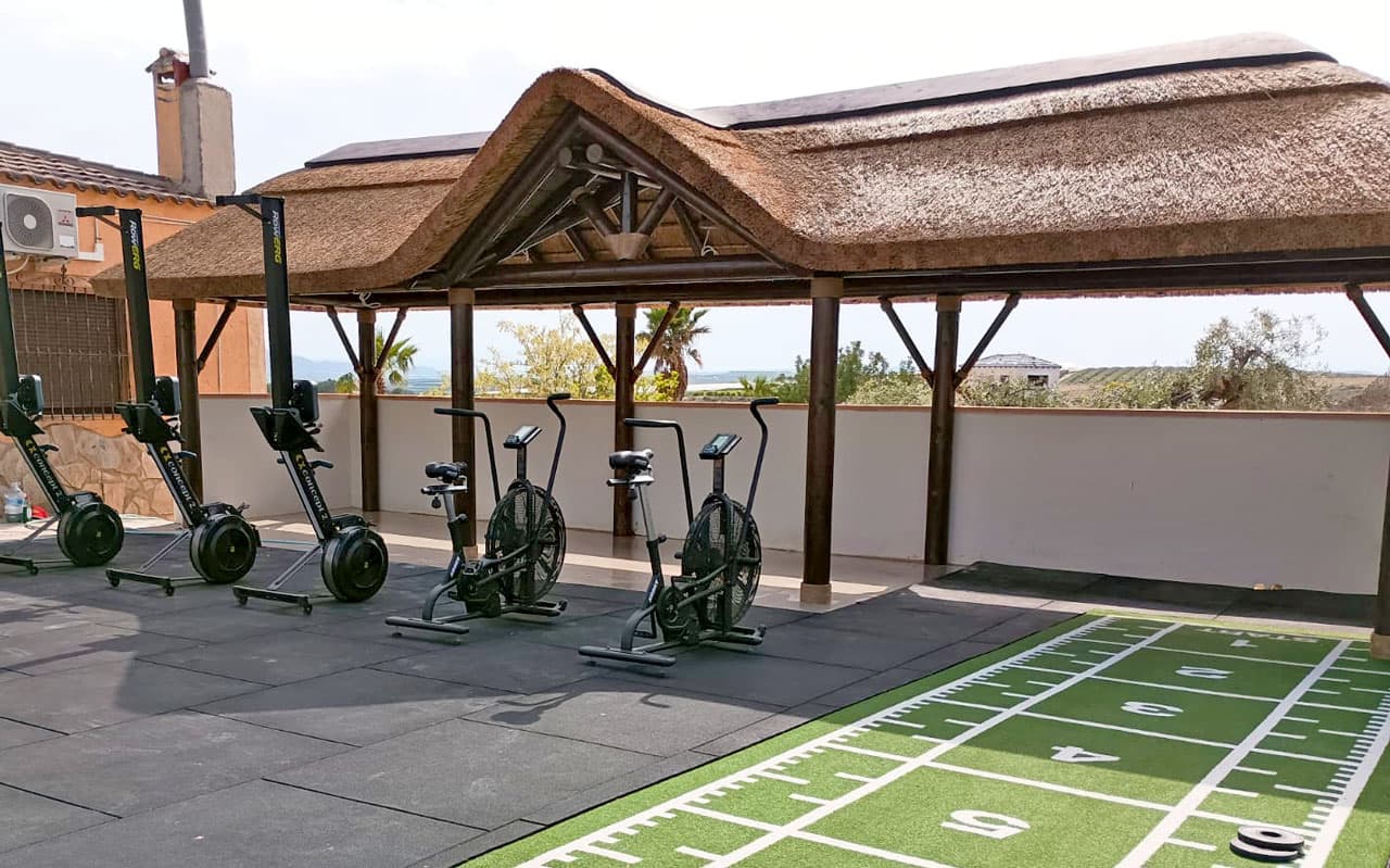 Luxury timber and thatched pavilion at CrossFinca boutique fitness hotel in Spain