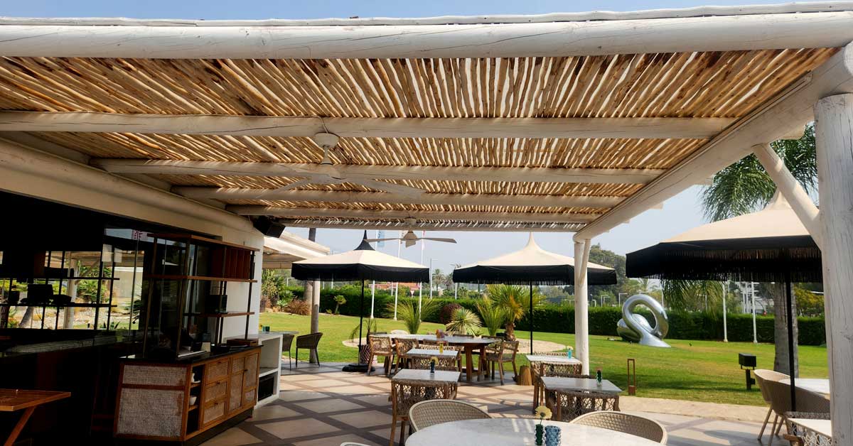 Wooden whitewash pergola at the Boho Club in Marbella